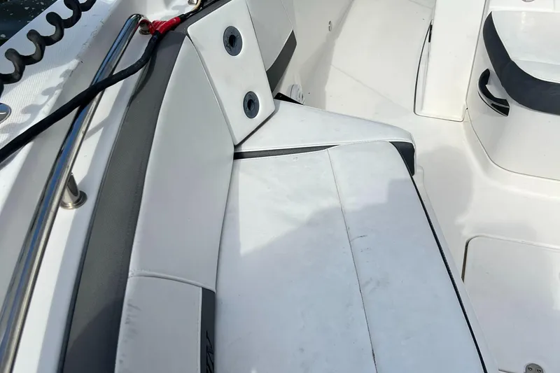 Slide: The Image of 2019 Blackfin 242 CC boat interior with white seating and sleek design. - 7