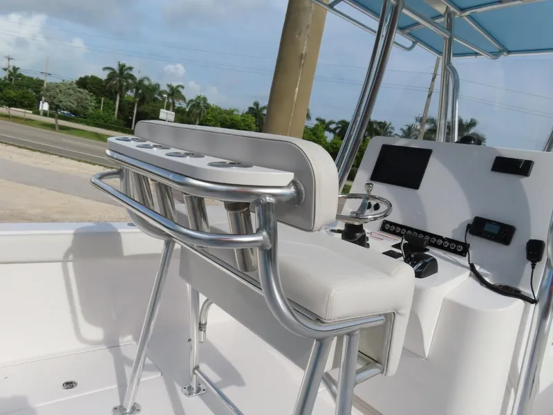 Slide: The Image of 2024 Contender 24S boat interior with helm and seating, featuring modern controls and sleek design. - 10