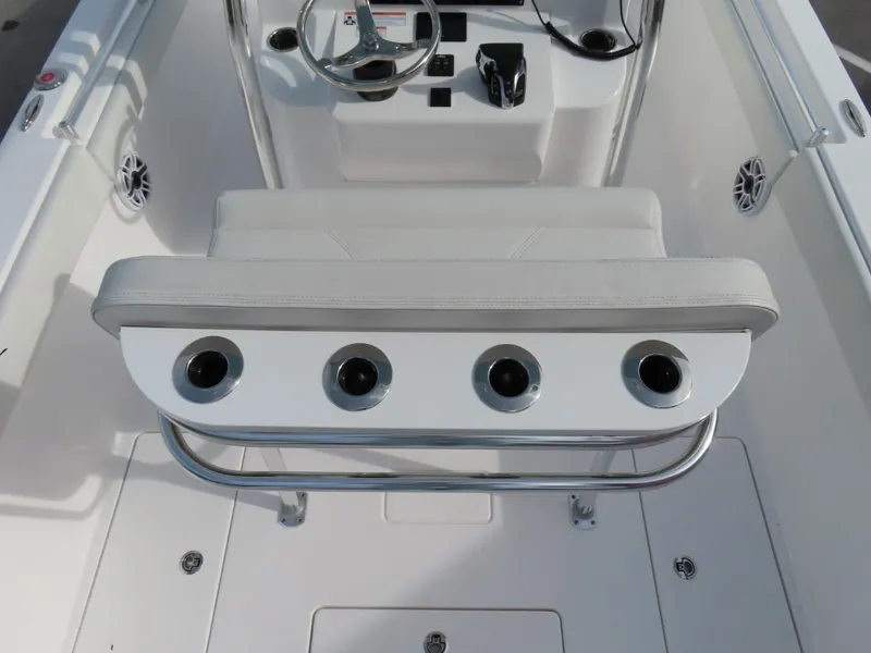 Slide: The Image of 2024 Contender 24S boat interior with rod holders and steering console. - 11