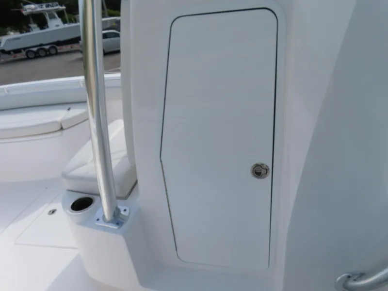 Slide: The Image of 2024 Contender 24S boat interior with storage compartment and seating area. - 13