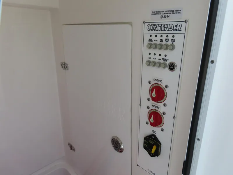 Slide: The Image of Control panel of 2024 Contender 24S boat with switches and dials. - 14
