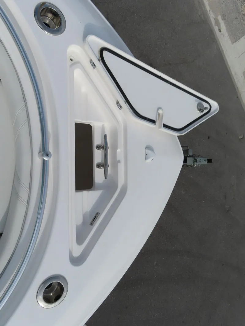 Slide: The Image of 2024 Contender 24S boat bow with anchor storage compartment. - 17