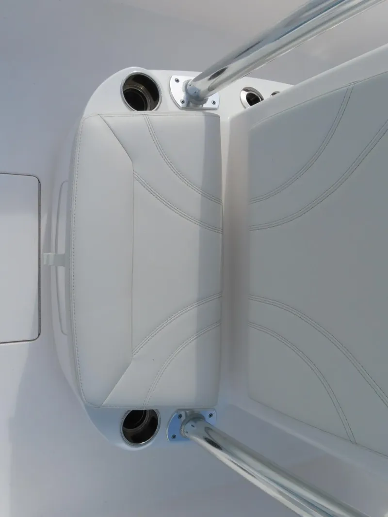 Slide: The Image of 2024 Contender 24S boat seat with cup holders and sleek design. - 19