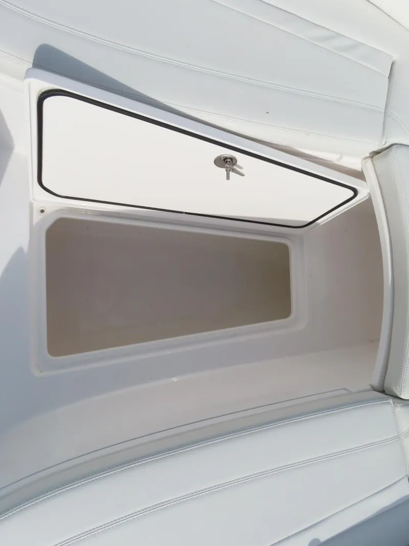 Slide: The Image of 2024 Contender 24S boat storage compartment with open hatch. - 23