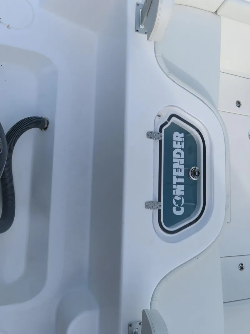 Slide: The Image of 2024 Contender 24S boat deck with storage compartment. - 6