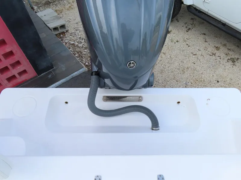 Slide: The Image of 2024 Contender 24S boat with Yamaha outboard motor, rear view. - 7