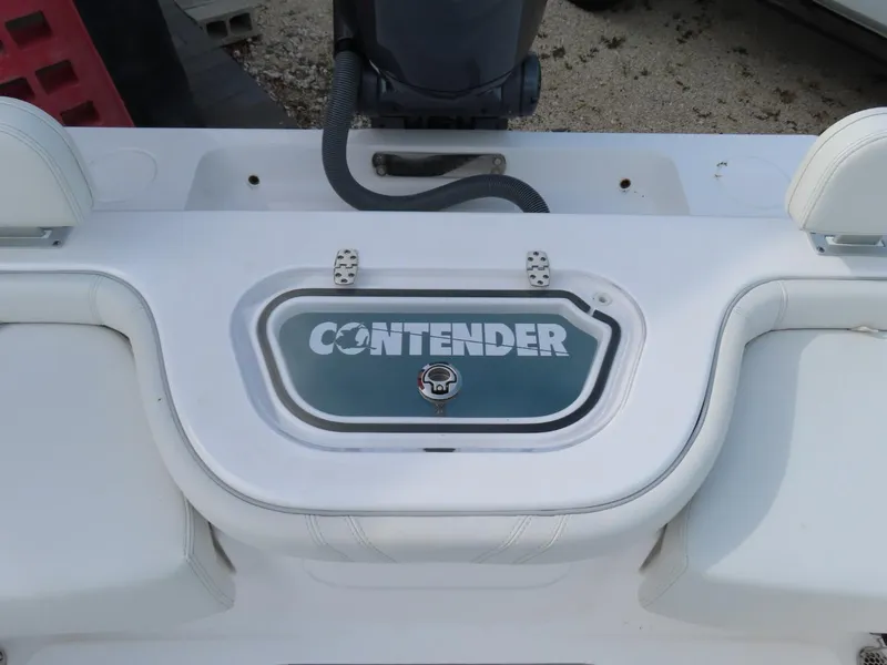 Slide: The Image of 2024 Contender 24S boat deck with logo and seating area. - 8