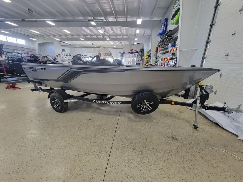 Slide: The Image of 2024 Crestliner 1750 HAWK SC JS boat on trailer in showroom. - 1