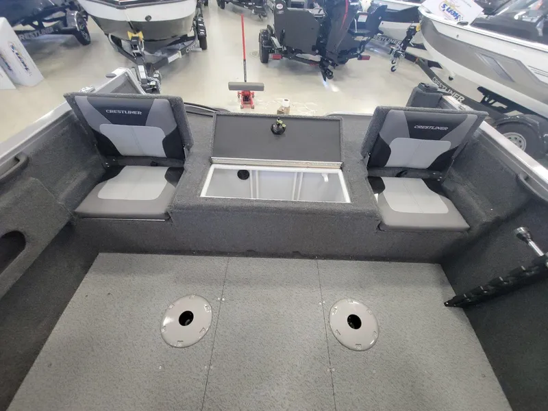 Slide: The Image of 2024 Crestliner 1750 HAWK SC JS boat interior with seating and storage compartments. - 16
