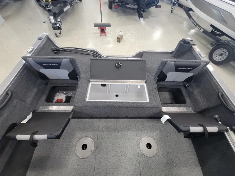 Slide: The Image of 2024 Crestliner 1750 HAWK SC JS boat interior with storage compartments and seating. - 17