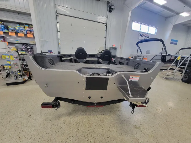 Slide: The Image of 2024 Crestliner 1750 HAWK SC JS boat in showroom, rear view. - 4