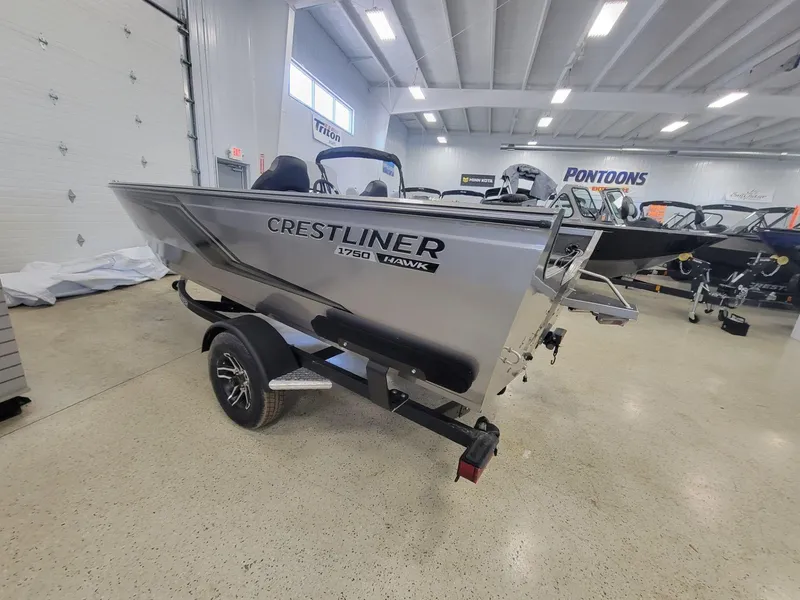 Slide: The Image of 2024 Crestliner 1750 HAWK SC JS boat in showroom, side view. - 5