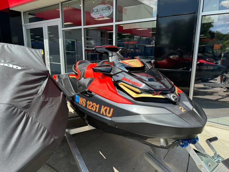 The Image of 2019 Sea-Doo RXT-X 300 iBR with sound system, parked outside dealership. - 1