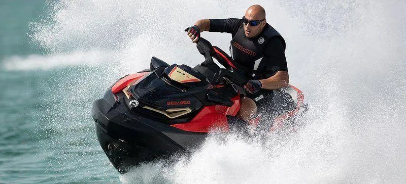 Slide: The Image of Man riding 2019 Sea-Doo RXT-X 300 iBR with sound system on water. - 31