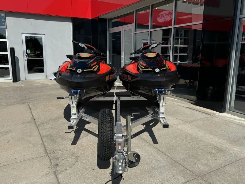 Slide: The Image of Two 2019 Sea-Doo RXT-X 300 iBR jet skis on a trailer outside a dealership. - 4