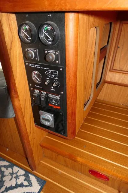 Slide: The Image of Control panel inside 2000 Hunter 460 yacht with wooden interior. - 19
