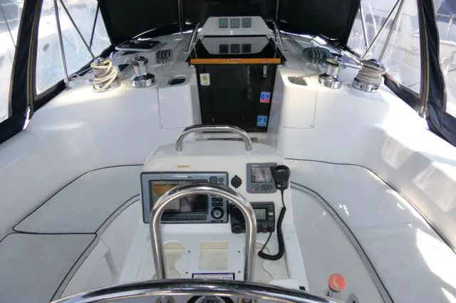 Slide: The Image of Interior cockpit of 2000 Hunter 460 sailboat with navigation equipment and seating. - 33