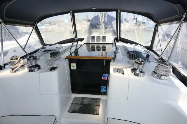 Slide: The Image of Interior view of a 2000 Hunter 460 sailboat cockpit with navigation equipment. - 34