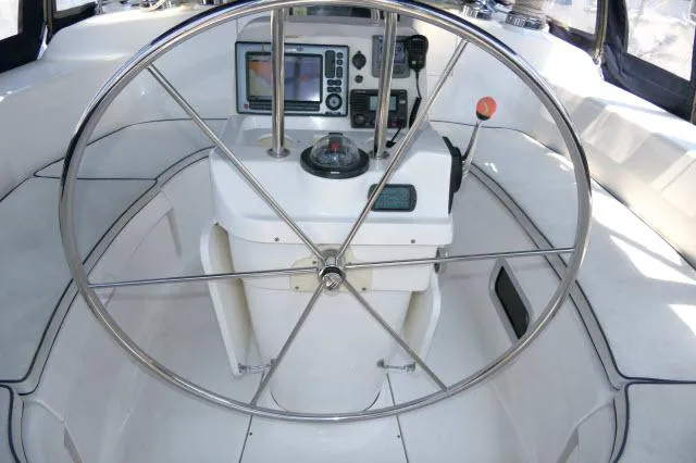 Slide: The Image of Steering wheel and navigation console of 2000 Hunter 460 sailboat. - 39