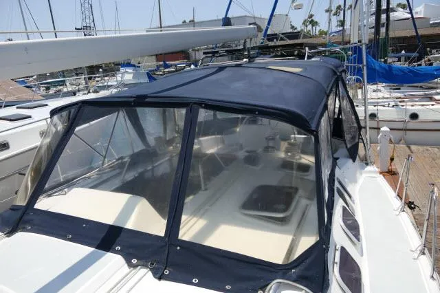 Slide: The Image of Hunter 460 sailboat, 2000 model, with blue canvas cockpit cover in marina. - 41