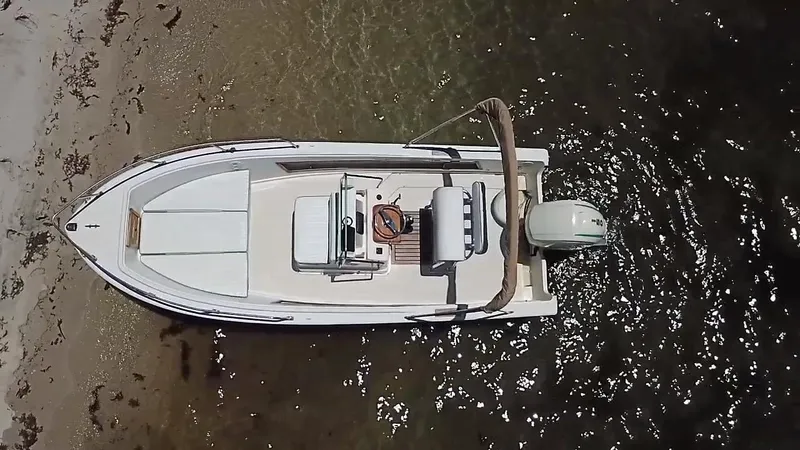 Slide: The Image of 1984 Aquasport 17 CC boat on sandy shore, aerial view. - 7