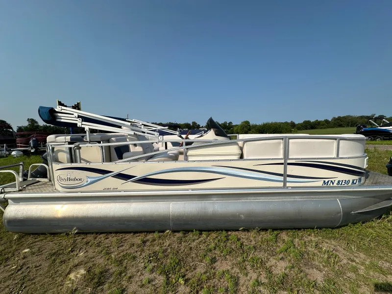 The Image of 2008 Misty Harbor 2085GM Grand Mistique pontoon boat on grassy area under clear sky. - 0