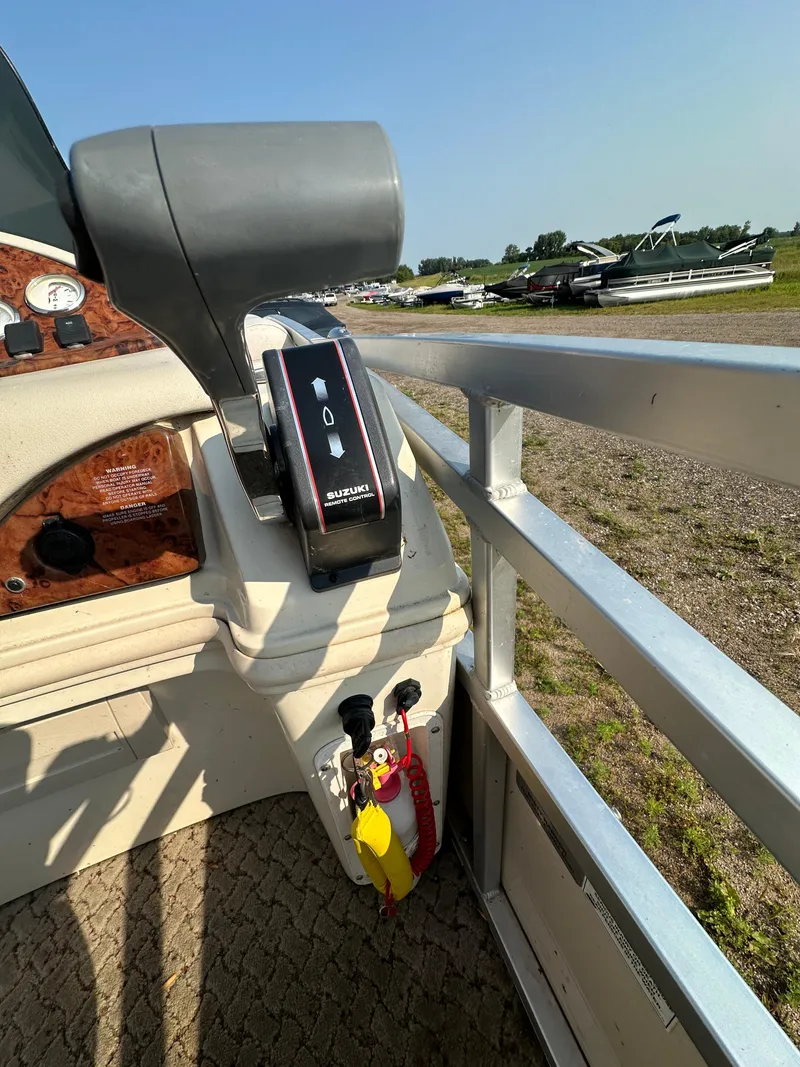 Slide: The Image of 2008 Misty Harbor 2085GM Grand Mistique boat controls and dashboard, outdoor setting. - 10