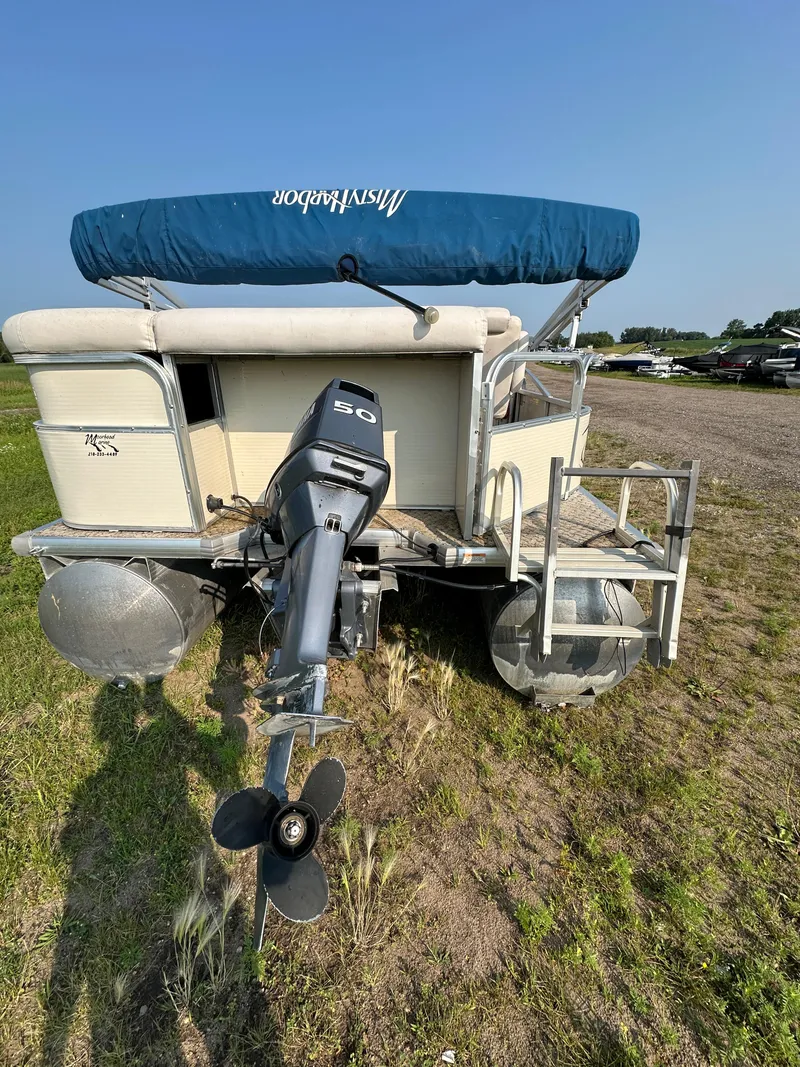 Slide: The Image of 2008 Misty Harbor 2085GM Grand Mistique pontoon boat with outboard motor, parked on grass. - 13