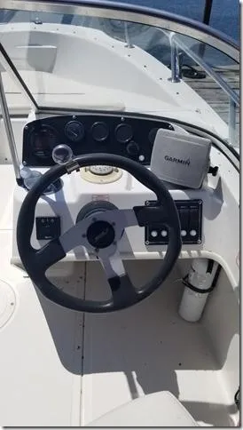 Slide: The Image of 2001 Boston Whaler 160 Ventura boat dashboard with Garmin navigation system. - 6