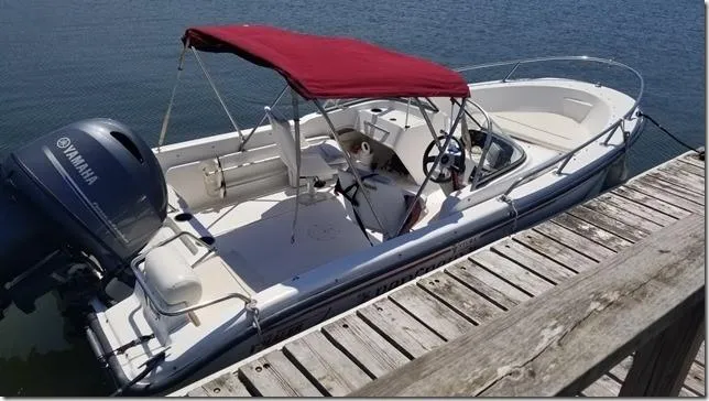 Slide: The Image of 2001 Boston Whaler 160 Ventura boat docked with Yamaha outboard motor. - 7