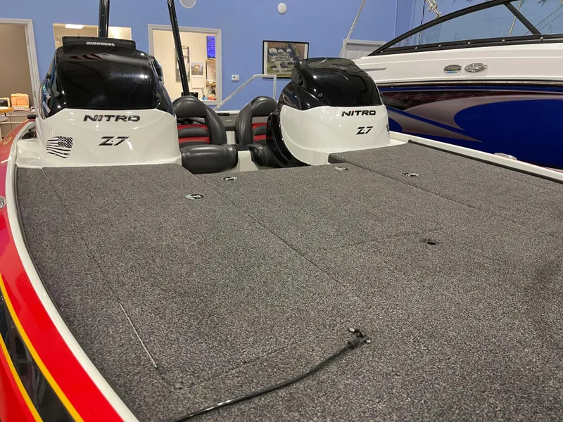 Slide: The Image of 2011 Nitro Z-7 boat interior with dual seats and carpeted deck. - 10