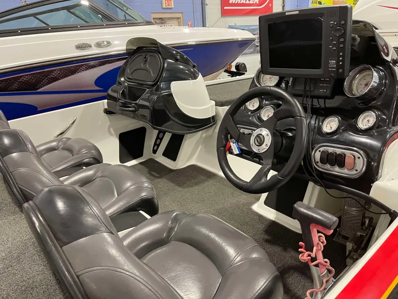 Slide: The Image of 2011 Nitro Z-7 boat interior with steering wheel, seats, and navigation equipment. - 7