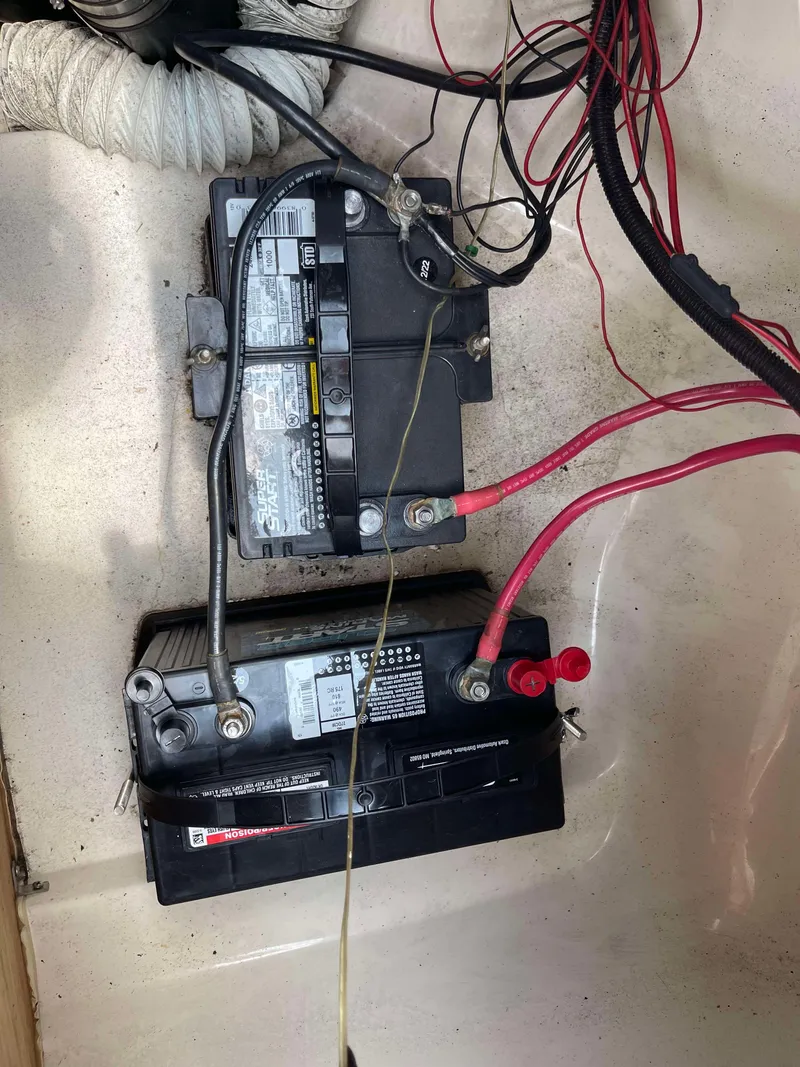Slide: The Image of Boat battery setup in 1998 Rinker 212 Captiva Cuddy with wiring connections. - 15