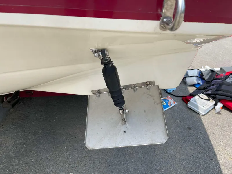 Slide: The Image of 1998 Rinker 212 Captiva Cuddy boat trim tab and accessories. - 20