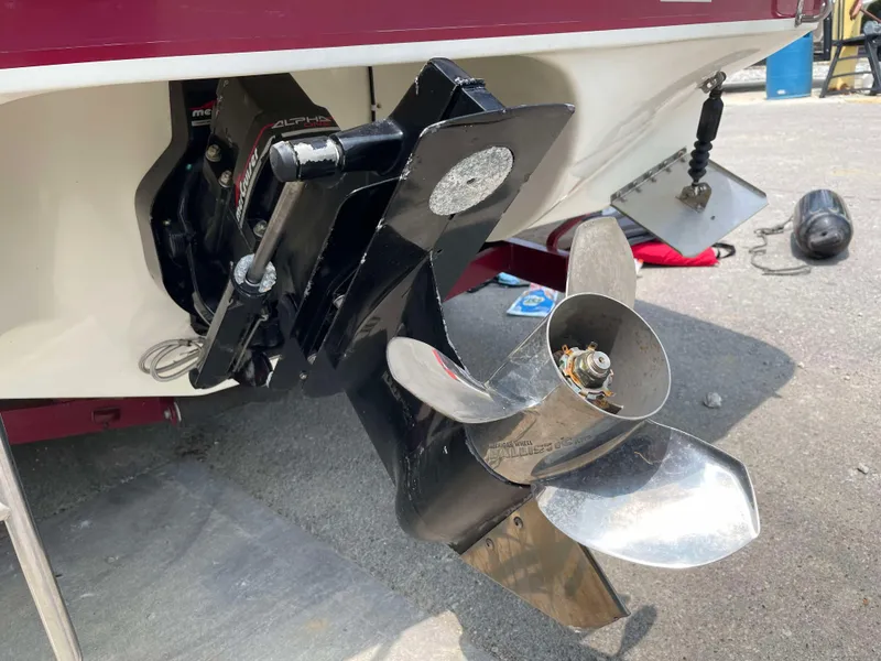 Slide: The Image of Close-up of 1998 Rinker 212 Captiva Cuddy boat propeller and outdrive. - 21