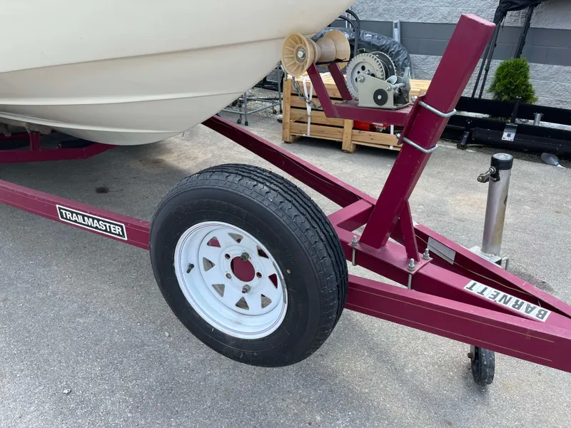 Slide: The Image of 1998 Rinker 212 Captiva Cuddy on red Trailmaster trailer. - 22