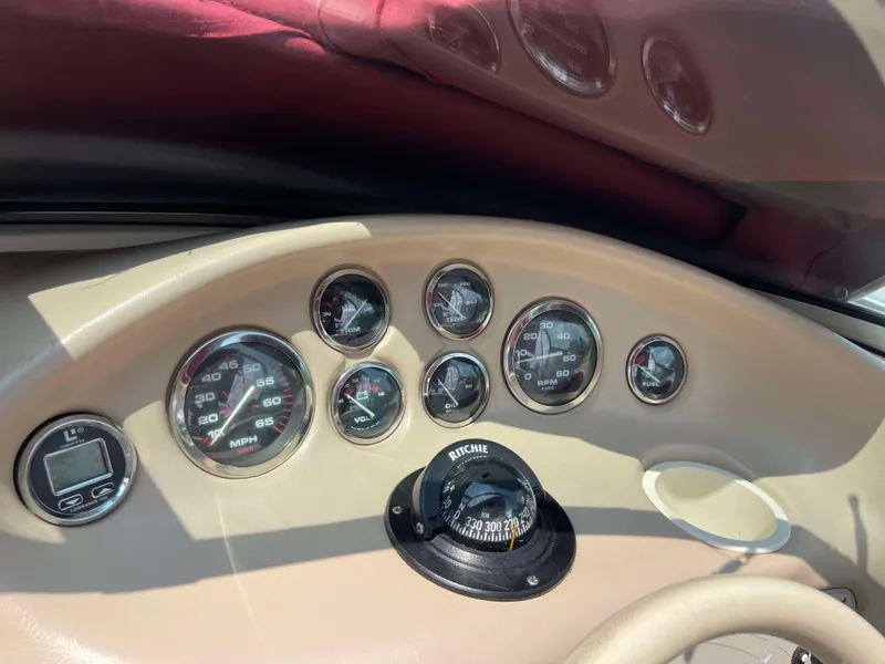 Slide: The Image of Dashboard of 1998 Rinker 212 Captiva Cuddy with gauges and compass. - 5