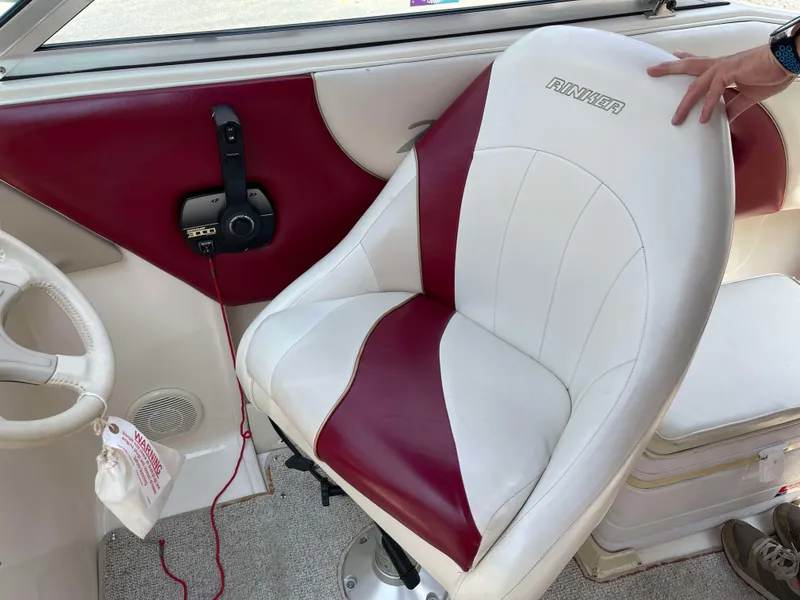 Slide: The Image of 1998 Rinker 212 Captiva Cuddy boat interior with red and white seating. - 7