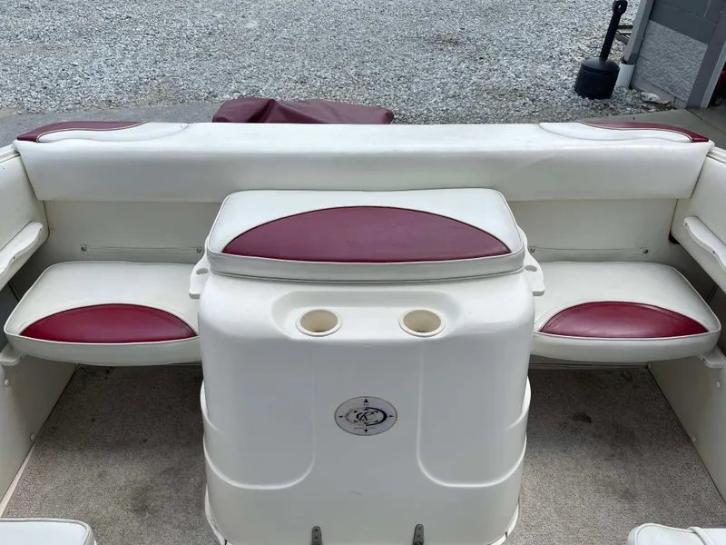 Slide: The Image of 1998 Rinker 212 Captiva Cuddy boat interior with white and red seating. - 9