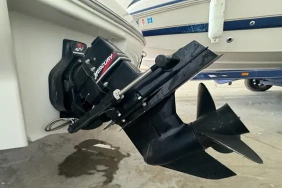 Slide: The Image of Outboard motor of a 2000 Sea Ray 210 Bow Rider boat in a marina. - 11