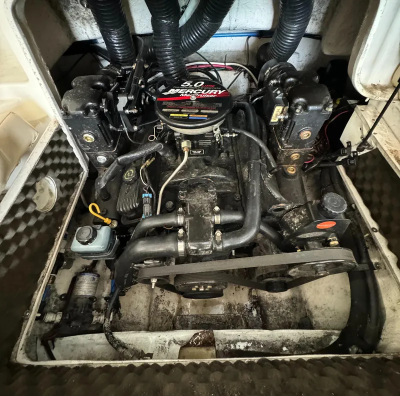 Slide: The Image of Engine compartment of a 2000 Sea Ray 210 Bow Rider with a 5.0 Mercury engine. - 15