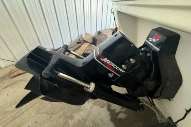 Slide: The Image of Outboard motor of a 2000 Sea Ray 210 Bow Rider boat in a storage area. - 6