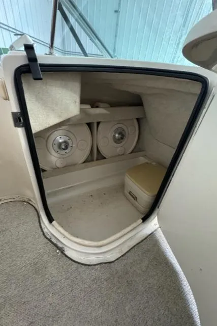 Slide: The Image of Storage compartment in a 2000 Sea Ray 210 Bow Rider boat. - 8