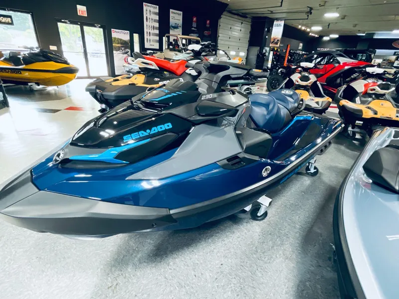 Slide: The Image of 2024 Sea-Doo GTX 230 iBR iDF with sound system in showroom. - 3