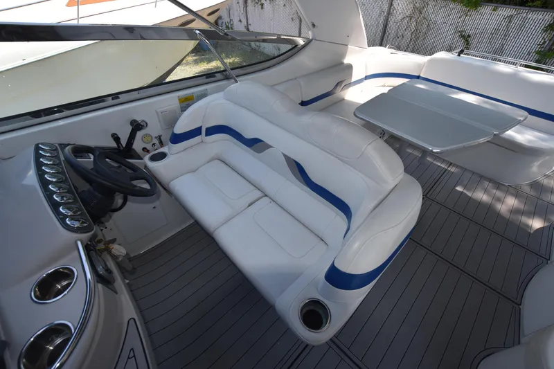 Slide: The Image of Interior of 2004 Formula 400 Super Sport boat with white and blue seating. - 10