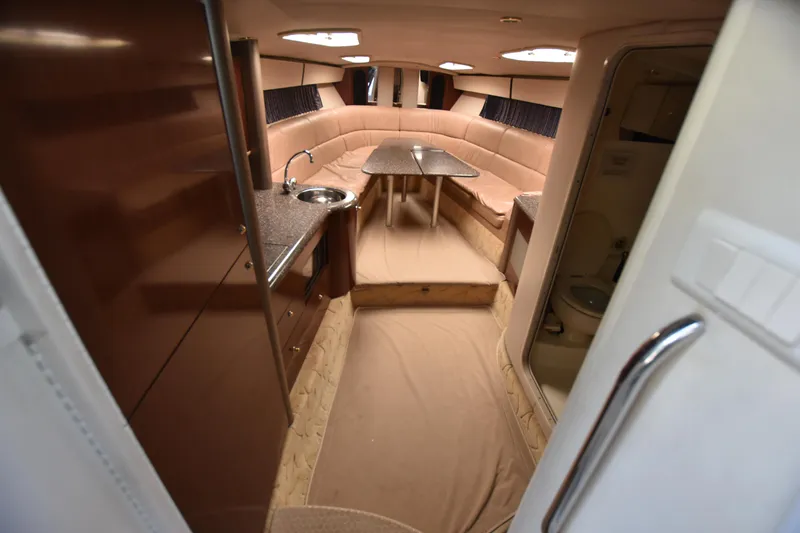 Slide: The Image of Interior of 2004 Formula 400 Super Sport yacht with seating, kitchenette, and bathroom. - 14