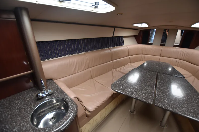 Slide: The Image of Luxurious interior of 2004 Formula 400 Super Sport yacht with leather seating and kitchenette. - 17