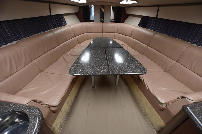 Slide: The Image of Luxurious interior of 2004 Formula 400 Super Sport yacht with plush seating and sleek table. - 18