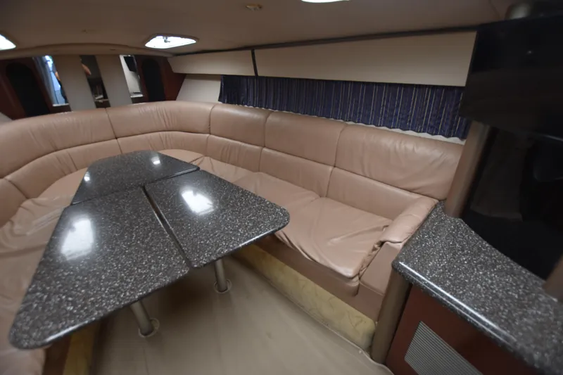 Slide: The Image of Luxurious interior of 2004 Formula 400 Super Sport yacht with leather seating and sleek table. - 19
