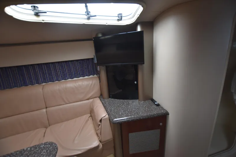 Slide: The Image of Interior of 2004 Formula 400 Super Sport with leather seating and mounted TV. - 20